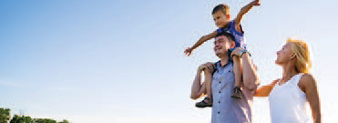 happy young family outdoors.