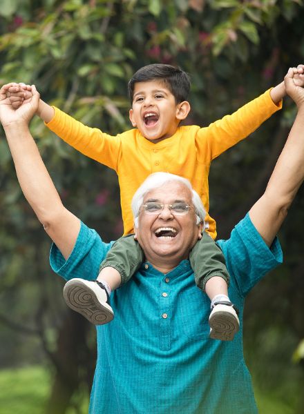 grandpa with grandkid on shoulders