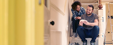 Young couple remodeling their home.