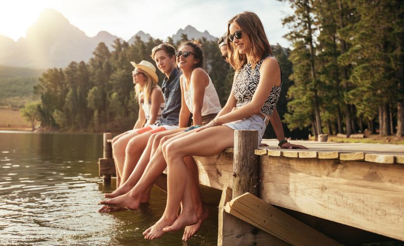 family enjoying lake dock together