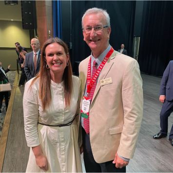 Governor of Arkansas with CS Bank staff member