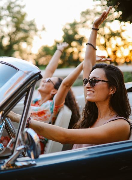 girls enjoying convertible