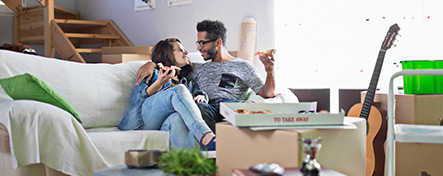 Young couple moving into a new home.