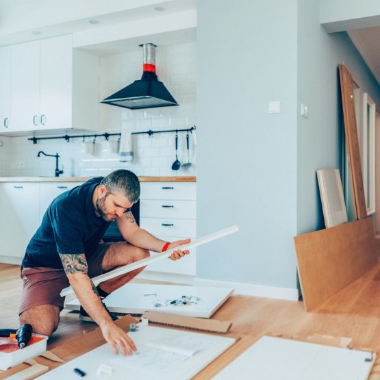man looking over renovation plans