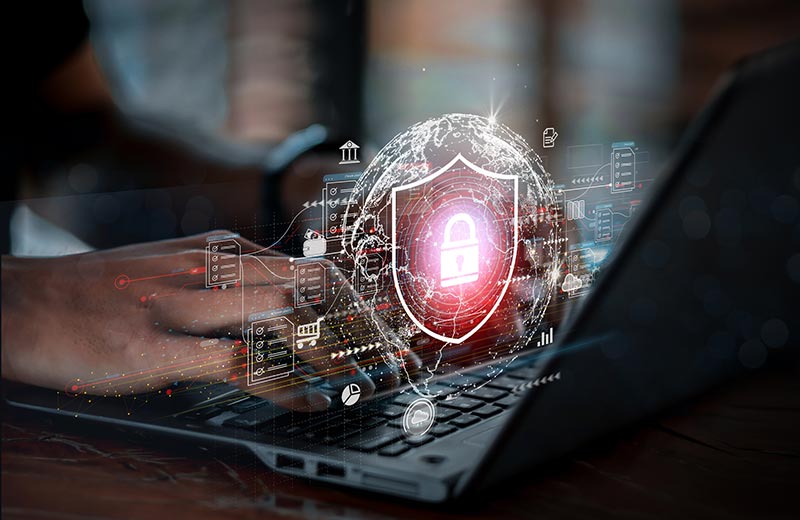 Person typing on laptop with security images