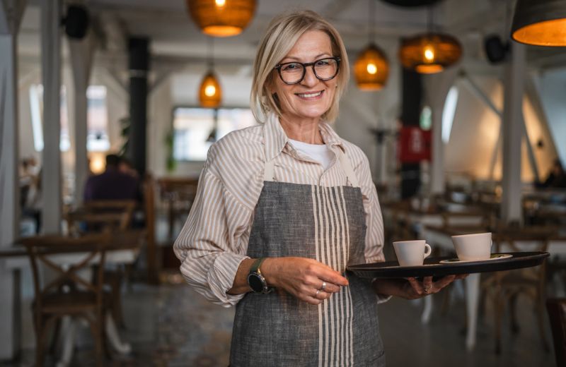 middle age business owner at cafe