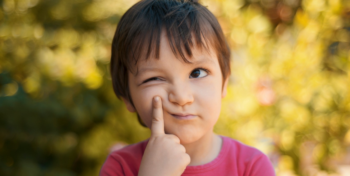 close-up portrait of little girl looking away thoughtfully