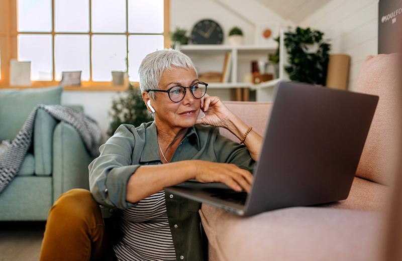Woman using laptop at home