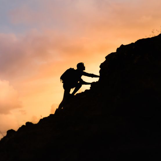 climbing mountains at sunset