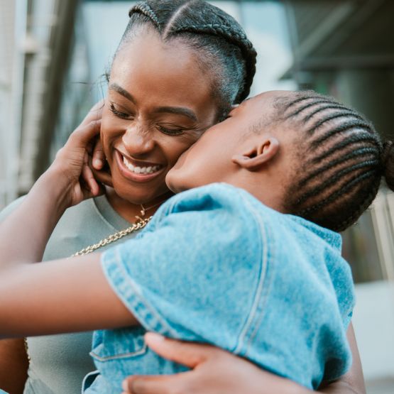 mom and daughter hugging