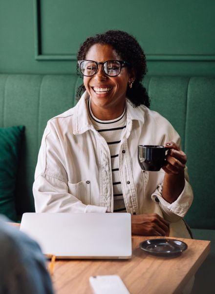 lady smiling at coffee